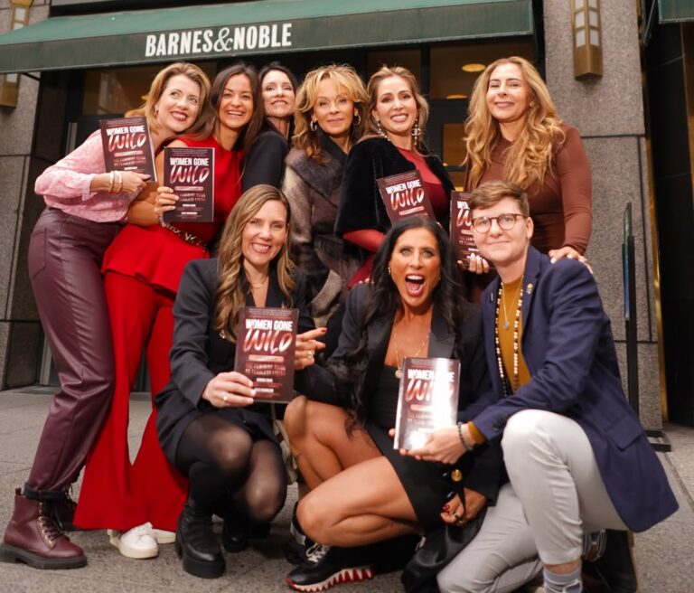Co-authors pose and celebrate outside Barnes & Noble storefront in New York City, with copies of their book 'Women Gone Wild: Leadership.'